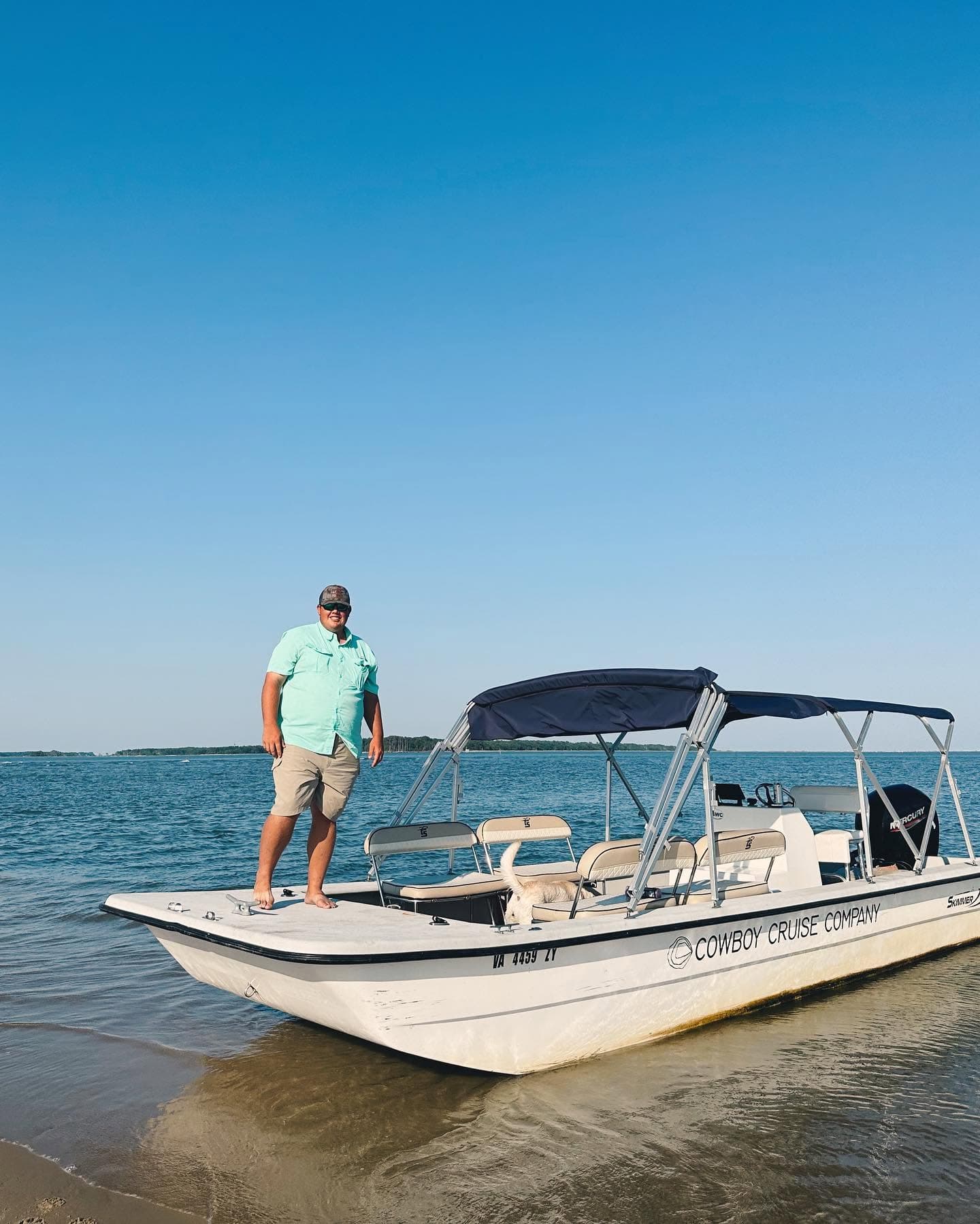 Captain Hunter Leonard aboard the Cowboy Cruise Company boat in the Assateague Channel, Chincoteague, Virginia