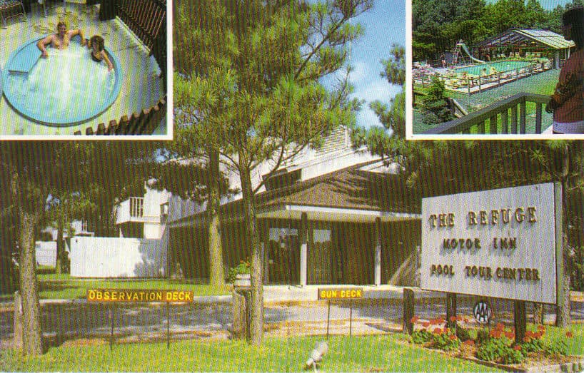A vintage postcard of the Refuge Motor Inn on Chincoteague Island, showing the pool, the grounds among the pines, and the motel's entrance sign.