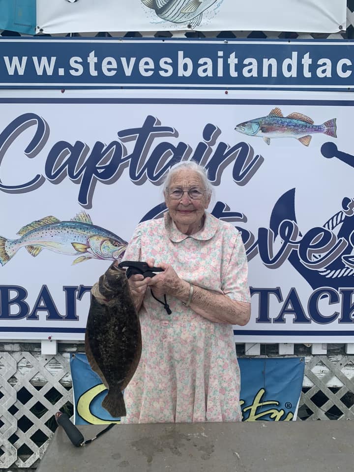 An angler holding a flounder caught off Chincoteague, outside Capt. Steve's Bait and Tackle on Maddox Boulevard.